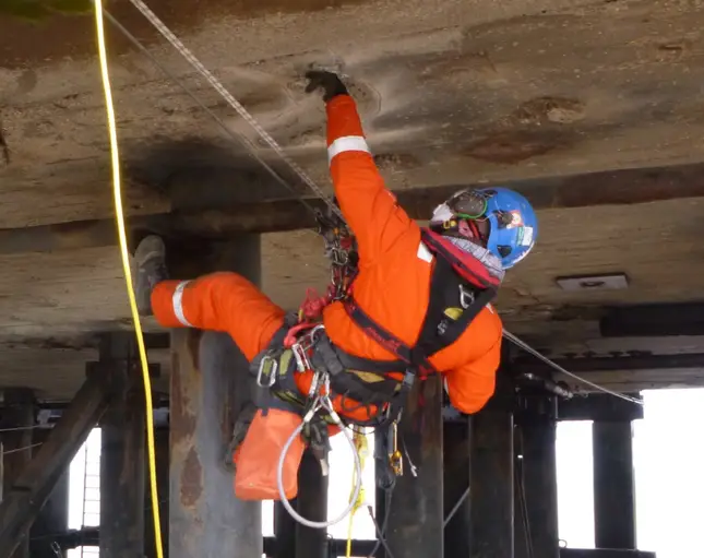 worker repairing concrete