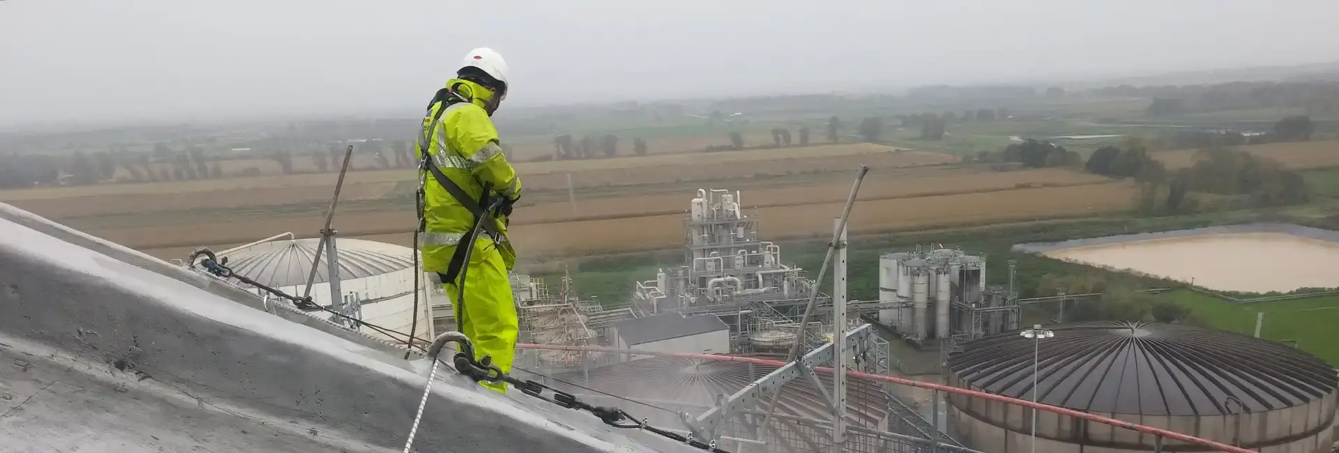 abseiler standing on roof