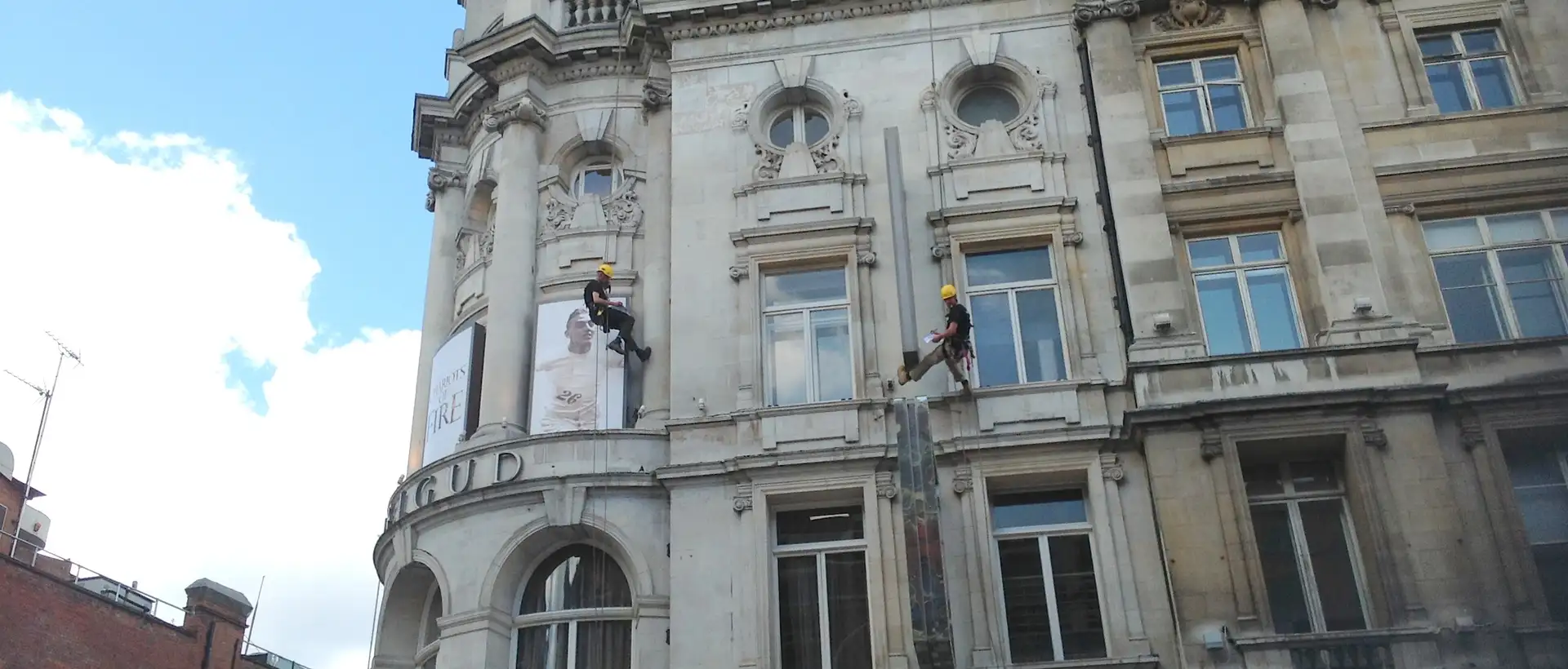 man abseiling down building
