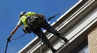 man abseiling