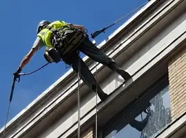 man using industrial rope access
