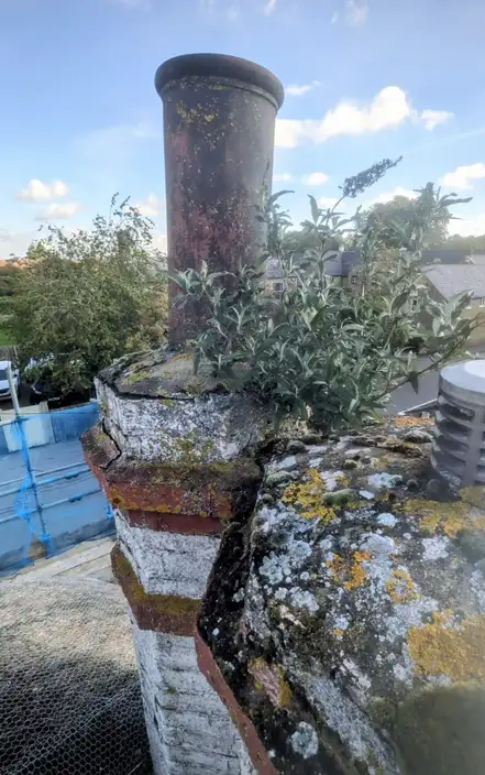 damaged chimney with scaffolding